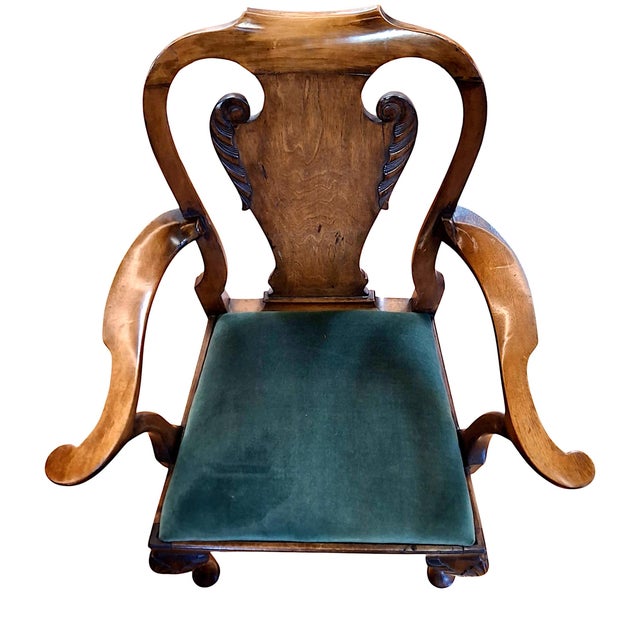On offer is an armchair that stylistically bridged two royal reigns in English history. The transition took place the end...