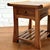 A charming pair of side tables each featuring a single drawer and a slatted lower shelf. The tabletops carry a subtle...