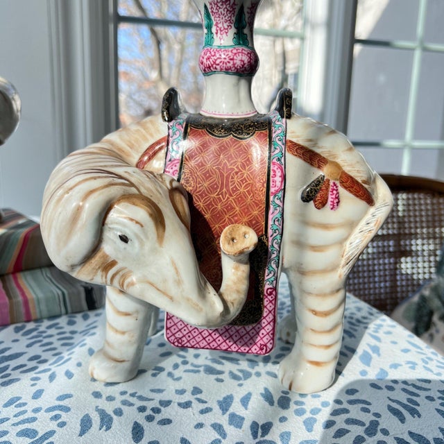 This is a gorgeous set of two vintage mirror-matched elephant candleholder made for Mottahedeh - a beautiful pair of...