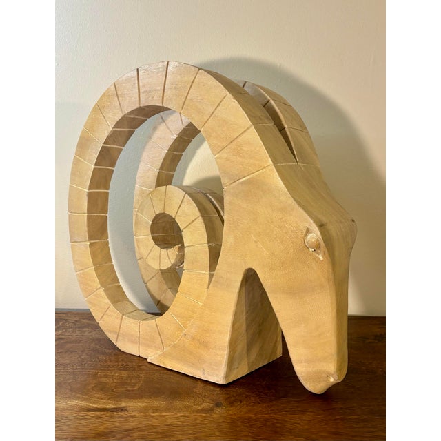 This vintage mid-century modern handmade wood ram’s head sculpture features a bold, sculptural form with strong visual...