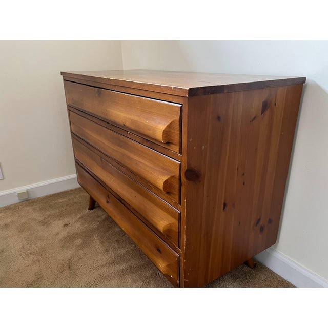 Offering an authentic four-drawer "Smallboy" dresser by the Franklin Shockey Company. Part of the highly collectible...