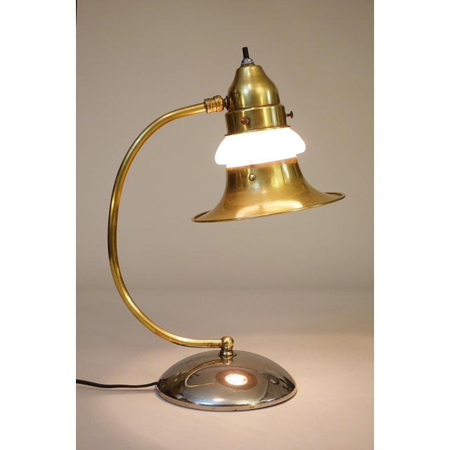 A rare and striking Art Deco Streamline styled solid Brass "Halo" Milk glass shade design lamp designed and manufactured...