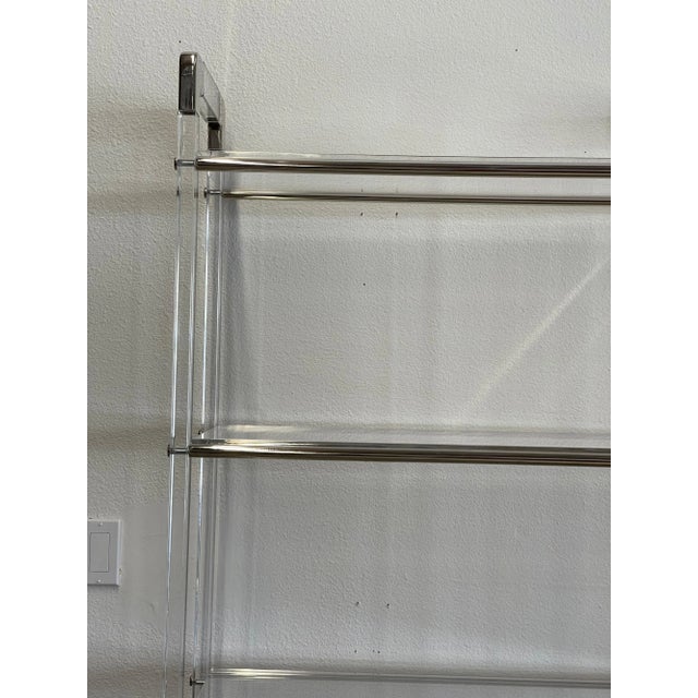 Charles Hollis Jones lucite and nickel etagere with 5 shelves. The shelves are lucite as well. Nice form. The shelves fit...