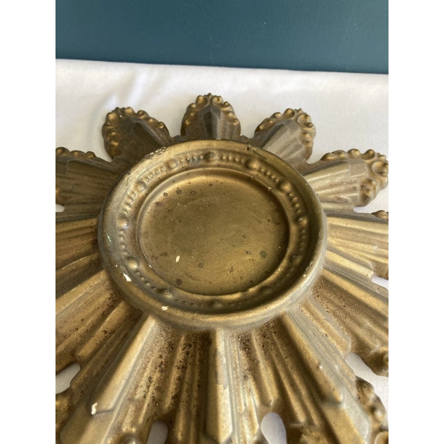 A standout addition to your vintage finds, this gold ceramic starburst candleholder features a unique pattern and...