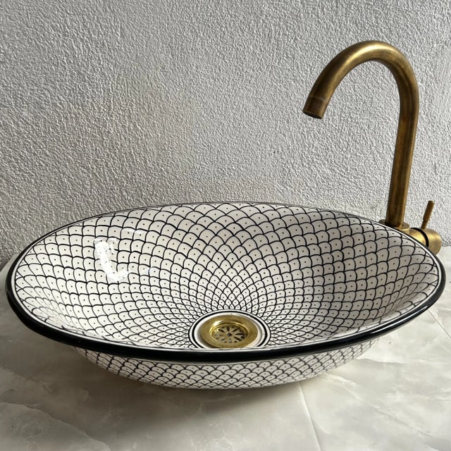 Handcrafted Moroccan 18" Oval Ceramic Sink Transform your bathroom with the timeless elegance of our 18"inch handcrafted...