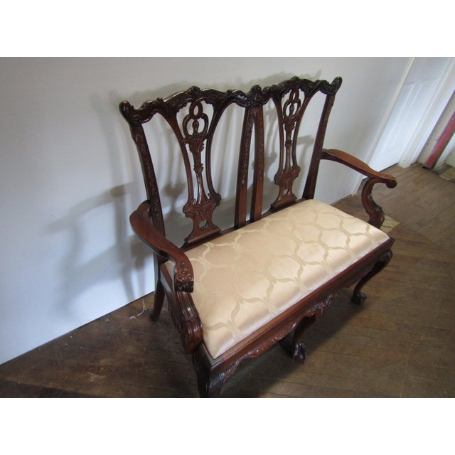 Item 86551: Chippendale style solid mahogany settee. Age: 1990's. Details: Ball and clawfeet. Condition: Very clean...