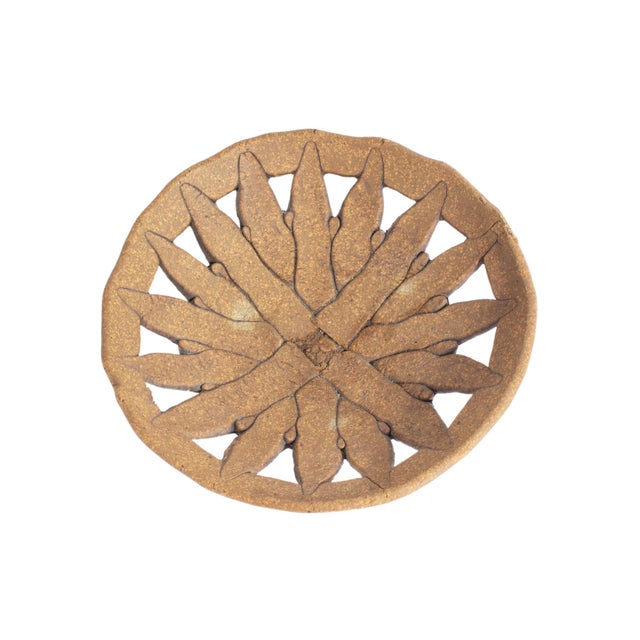 A signed studio pottery bowl by the American ceramicist Michael Zoeller. This bowl features a flower-like pierced design...