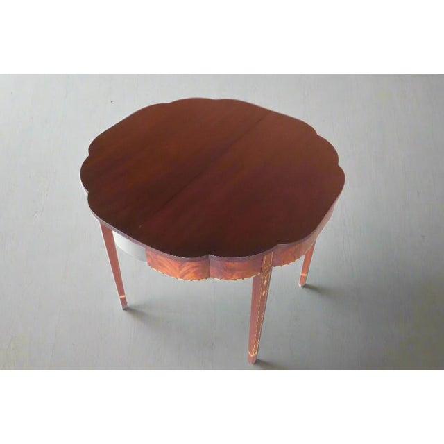 Stunning inlaid mahogany federal style flip top games table made by Henkel Harris, a traditional fine furniture company...