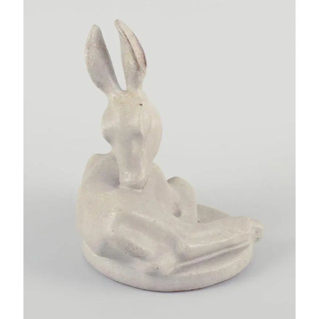 Arne Bang (1901-1983), ceramic sculpture of a fawn. Glaze in light sandy tones. Model number: 11 Mid-20th century. Signed....