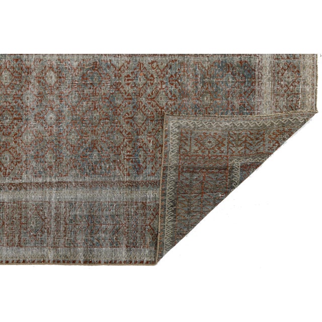 Elevate your space with the timeless elegance of this authentic antique Malayer wool rug. Hand-knotted with master...