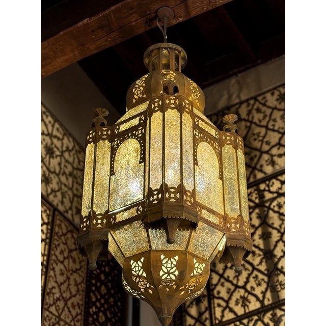 Monumental Arab-Moorish Hanging Lantern in Pierced Metal with Translucent Panels, circa 1920–1940 A striking and highly...