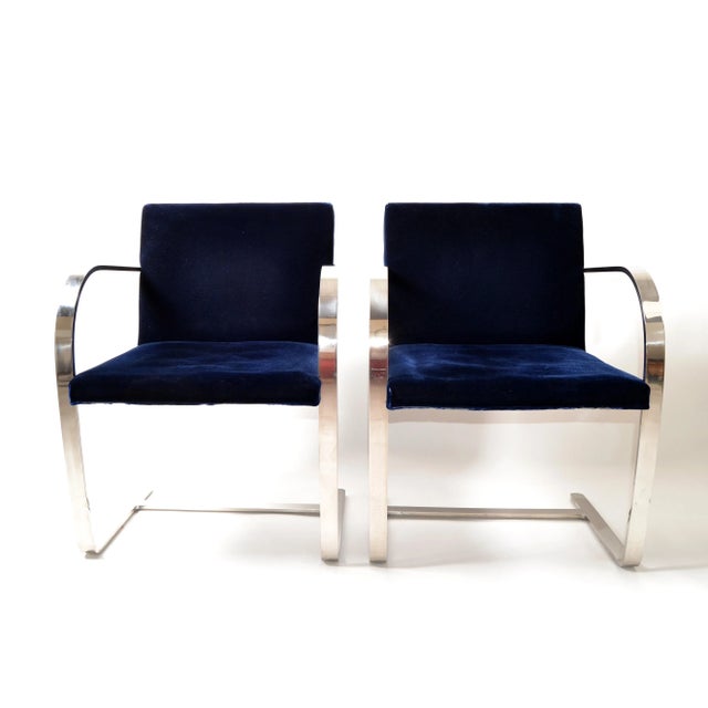 Pair of Mid-Century Modern Mies van der Rohe flatbar Brno for Knoll in stainless steel with the original navy blue velvet...