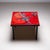 Square side table on a black iron frame and red glazed ceramic tiles with abstract polychrome decoration. The tiles are...