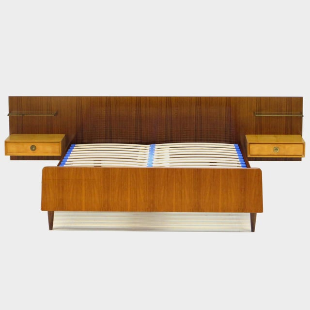 Vintage mid century modern double bed with floating nightstands in teak and flamed maple, 1960s. A stylish shelf in a...