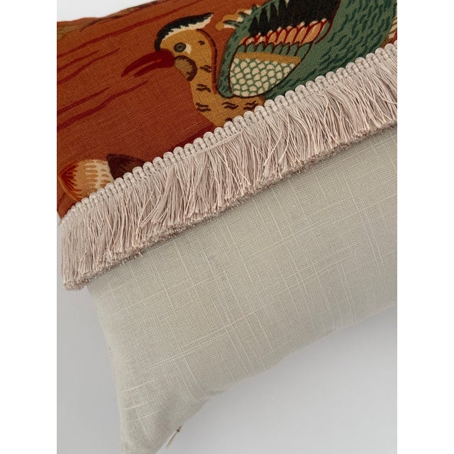 A fabulous small lumbar in an exclusive Schumacher Fabrics print, finished with a luxurious trim — a one-of-a-kind refined...