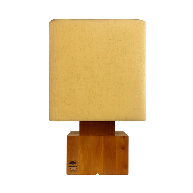 A striking mid-century modern table lamp by Regain, France, crafted in solid oak (bois massif) with the brand’s...