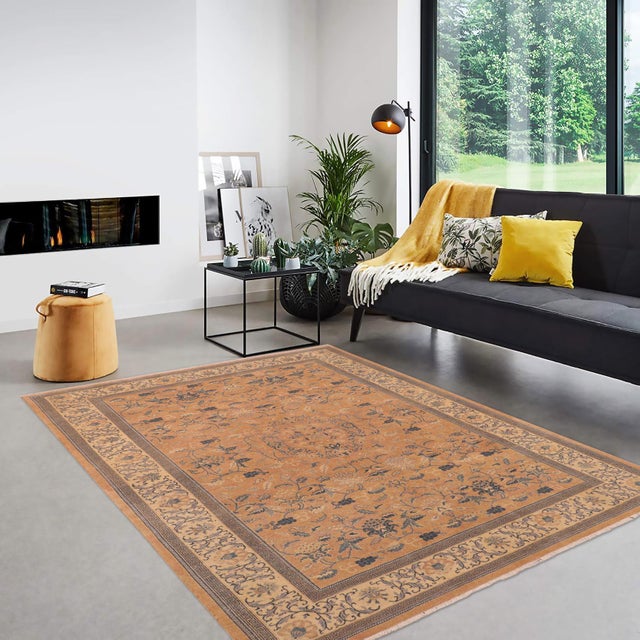 Enhance the ambiance of your home with this magnificent Persian-influenced Turkish hand-knotted rug made by skilled...