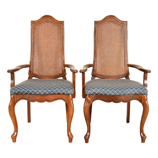 Baker Furniture Style French Provincial Louis XV Carved Walnut and Cane Back Armchairs, Pair For Sale