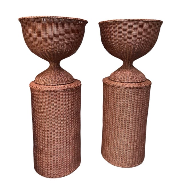 This impressive pair of vintage woven wicker urn planters combines dramatic scale with classic organic craftsmanship....