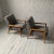 Pair of lounge chairs designed by Leslie Diamond for Conant Ball have open-arm frames of maple which support seats that...