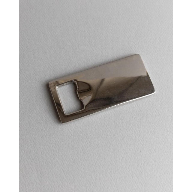 This silver-plated vintage bottle opener from the 1970s impresses with its simple yet timeless space-age design. It feels...