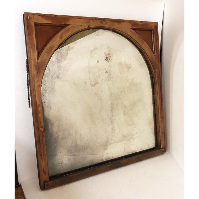 A handcrafted wall mirror made from a reclaimed window. The glass was hand silvered using the original 1900s process to...