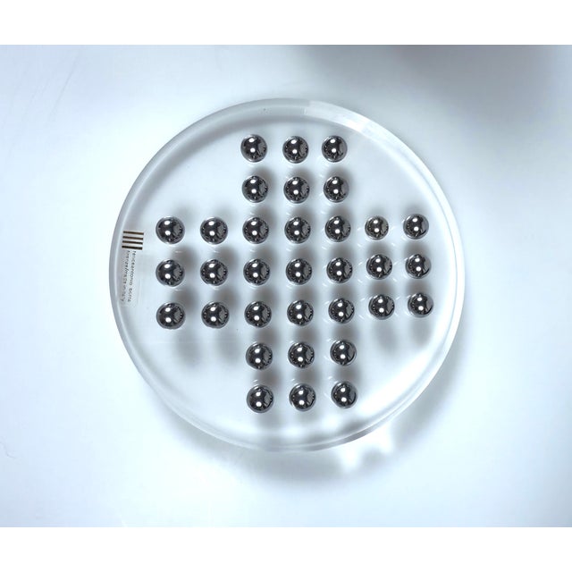 Italian solitaire game made of clear acrylic glass with steel balls. Designed and manufactured by Felice Antonio Botta,...