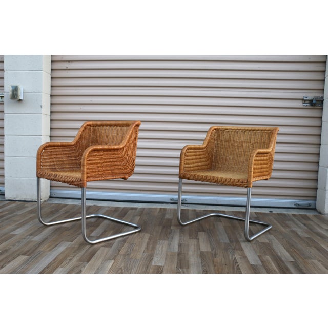 A stylish and sculptural pair of Model D43 dining armchairs designed by Harvey Probber in the 1970s, showcasing a perfect...