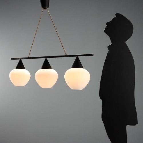 Vintage Italian-made ceiling lamp with a black lacquered metal frame and three opal glass diffusers. It features three E27...