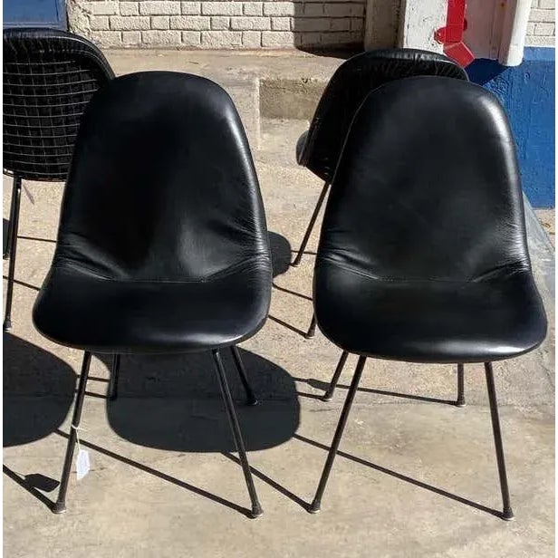 Charles and Ray Eames for Herman Miller DKX-1 chair, black leather, H-base, circa 1954, Boot glides .Pricing is per chair....