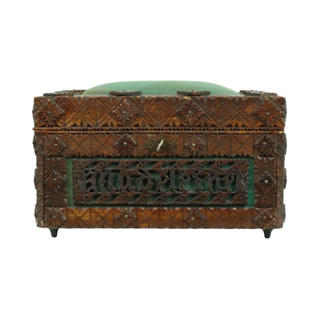 Antique sewing box—a wooden "tramp art" box featuring green fabric sections and a pin cushion on top. It is a unique,...