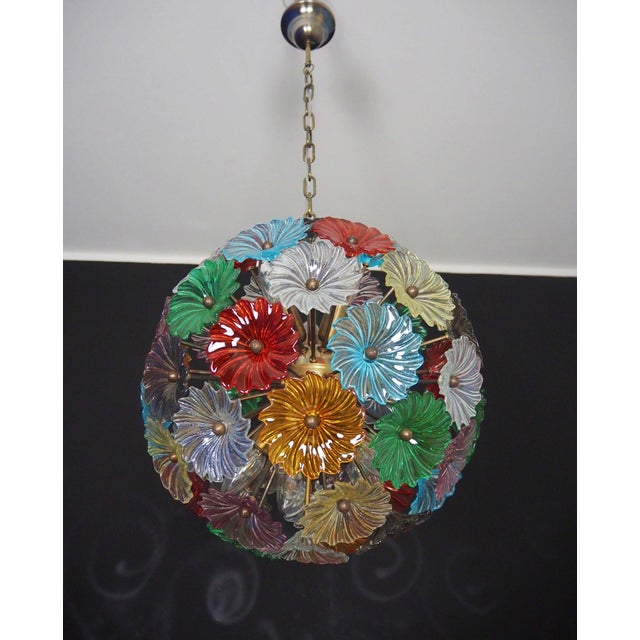 Italian Sputnik chandelier with 50 Murano pulegoso glass elements and a gold-plated metal frame, offered by...