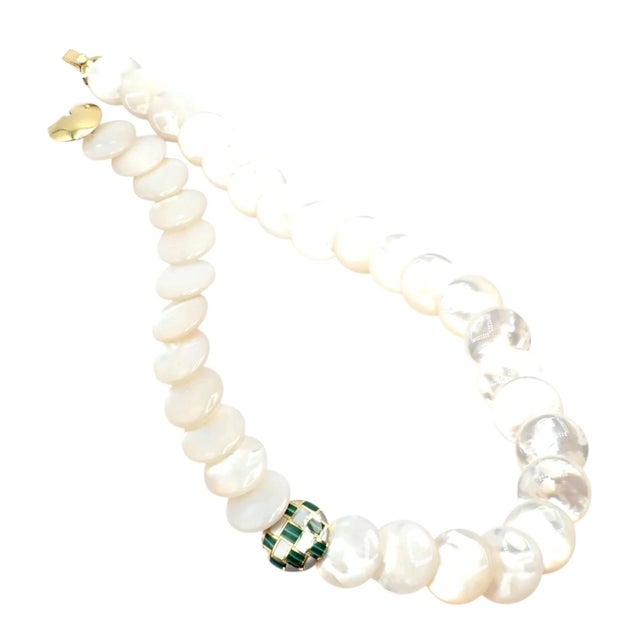 Tiffany & Co. Angela Cummings necklace crafted in 18k yellow gold with smooth mother-of-pearl links and a striking inlaid...