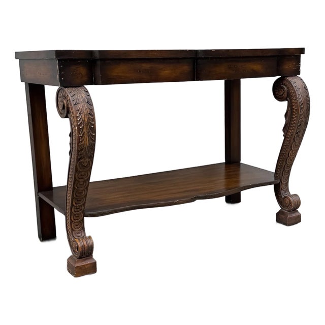 Vintage Neoclassical Revival Console Table With Ornately Carved Scroll Supports and Lower Shelf For Sale