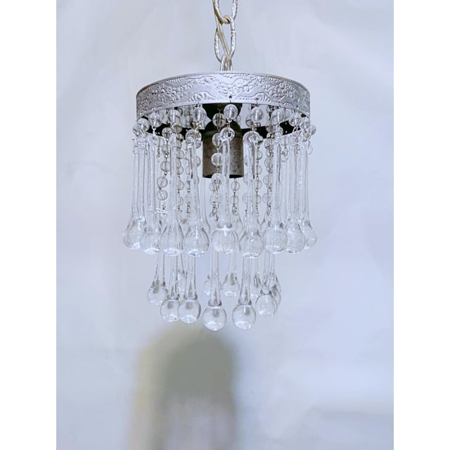 Elevate your interior styling with the icy glamour and shimmering brilliance of this vintage three-tier crystal waterfall...
