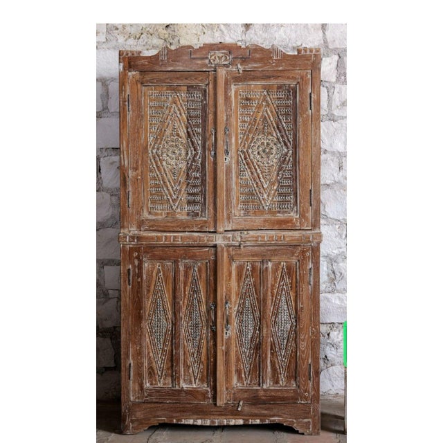 Celebrate timeless craftsmanship with this Antique Heritage Revival 4 Door Cabinet, richly adorned with hand-carved...