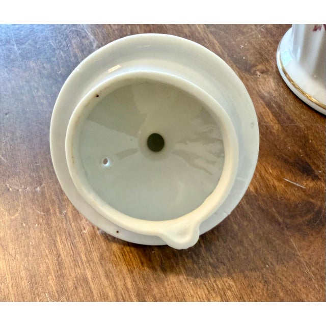 Today, this vintage rose teapot remains a testament to the art of fine living, inviting modern collectors to cherish the...