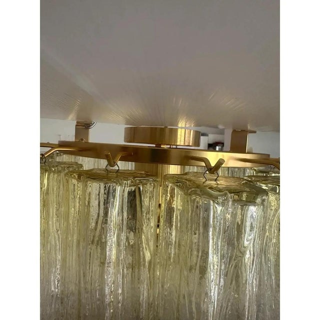 Scenographic italian hand-made flush mount with clear amber “tronchi” , elements of murano glass. elegant flush mount in a...