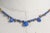 A striking yet delicate necklace comprised of faceted blue sapphire beads with three pear shaped drops at the front....