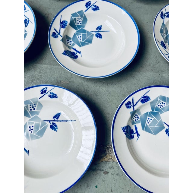 with their pretty stylized blue Art Deco flowers and border, these plates from the Keller et Guerin pottery in Lunéville...