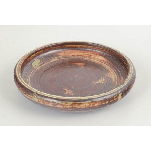 Carl Halier for Royal Copenhagen Bowl / Dish. Low, wide stoneware bowl with a pronounced concentric throwing pattern and a...