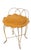 Voguish Hollywood Regency vanity stool constructed of gold finish metal rods, with a removable upholstered pad seat. This...