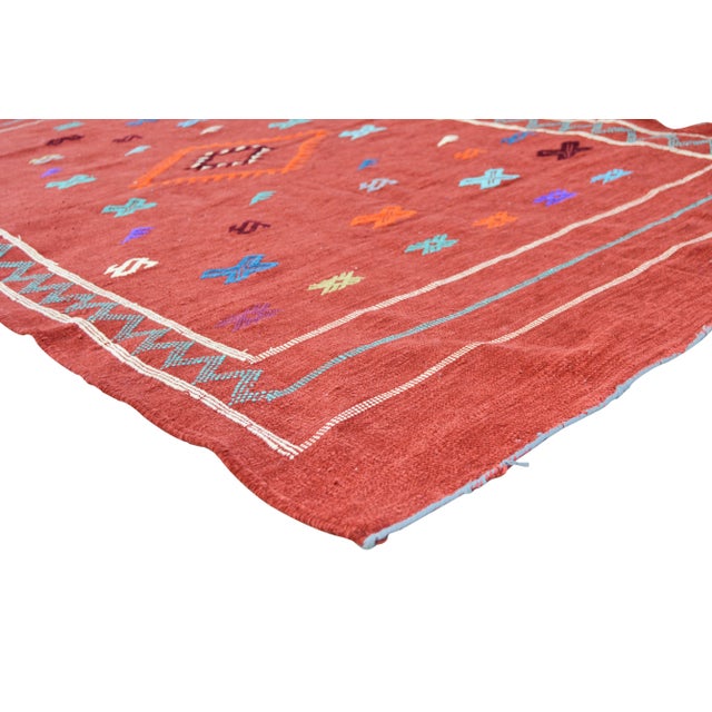 Handwoven Moroccan flat-weave wool and silk rug, featuring an elegant rhythmic pattern of colorful birds, intricate Berber...