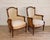 A finely proportioned pair of French bergères dating to circa 1830, reflecting the continued refinement of late Empire to...