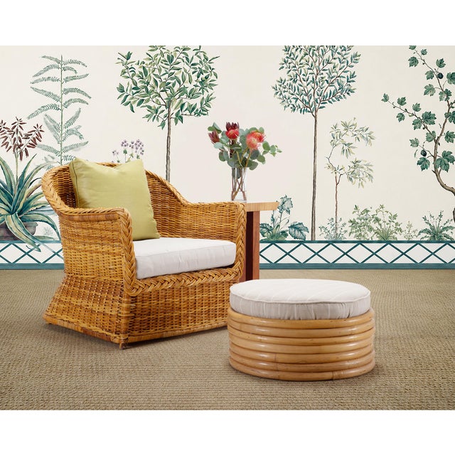 A stylish mid-century modern 7 strand stacked rattan ottoman, stool, or pouf designed by Paul T. Frankl. The round stool...