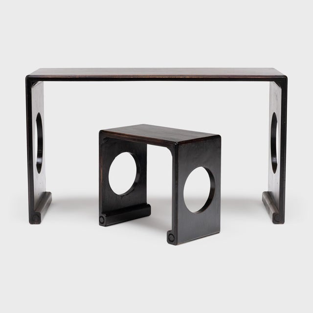 This minimalist table & stool set updates a classical Chinese form with the clean lines and geometric motifs of Art Deco...