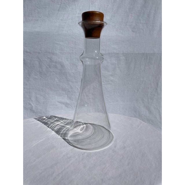 Beautiful and sleek Danish modern glass decanter. Teak wood topper. Exceptional condition. Perfect for any mid century...