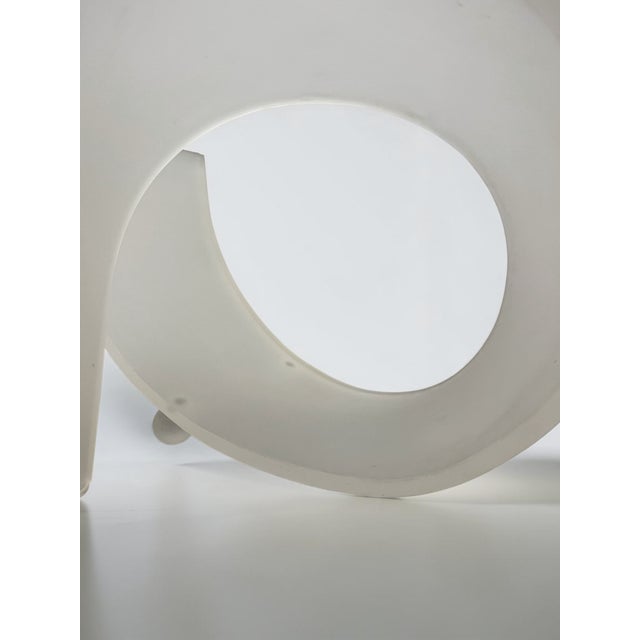 A striking vintage 1970s Space Age coffee table featuring a sculptural frosted acrylic base supporting a substantial...