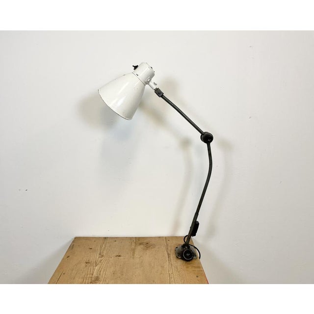 Large industrial table lamp with three adjustable joints made in former Czechoslovalia during the 1960s.It features grey...