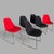 A striking set of six mid-century stackable egg chairs with black shells, red upholstered seats and chrome sled bases....
